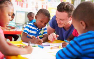 Volunteer teacher helping a class