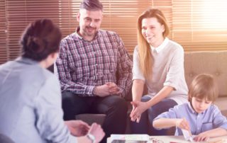 Family Talking With Teacher